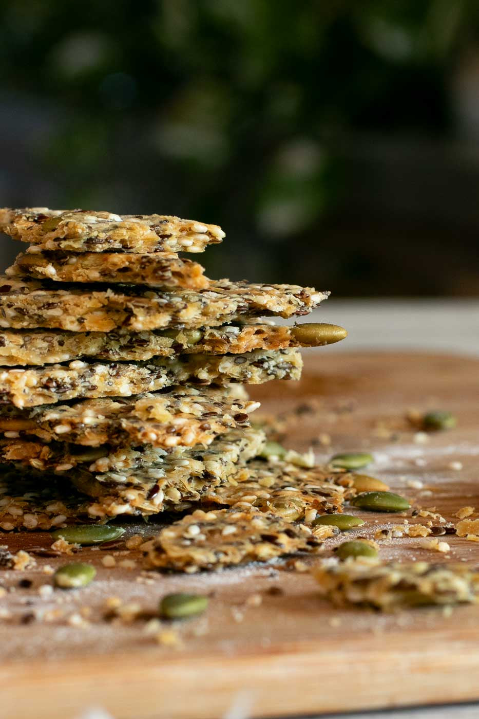Seedy Olive Oil Crackers in a stack with Cockatoo Grove Extra Virgin Olive Oil