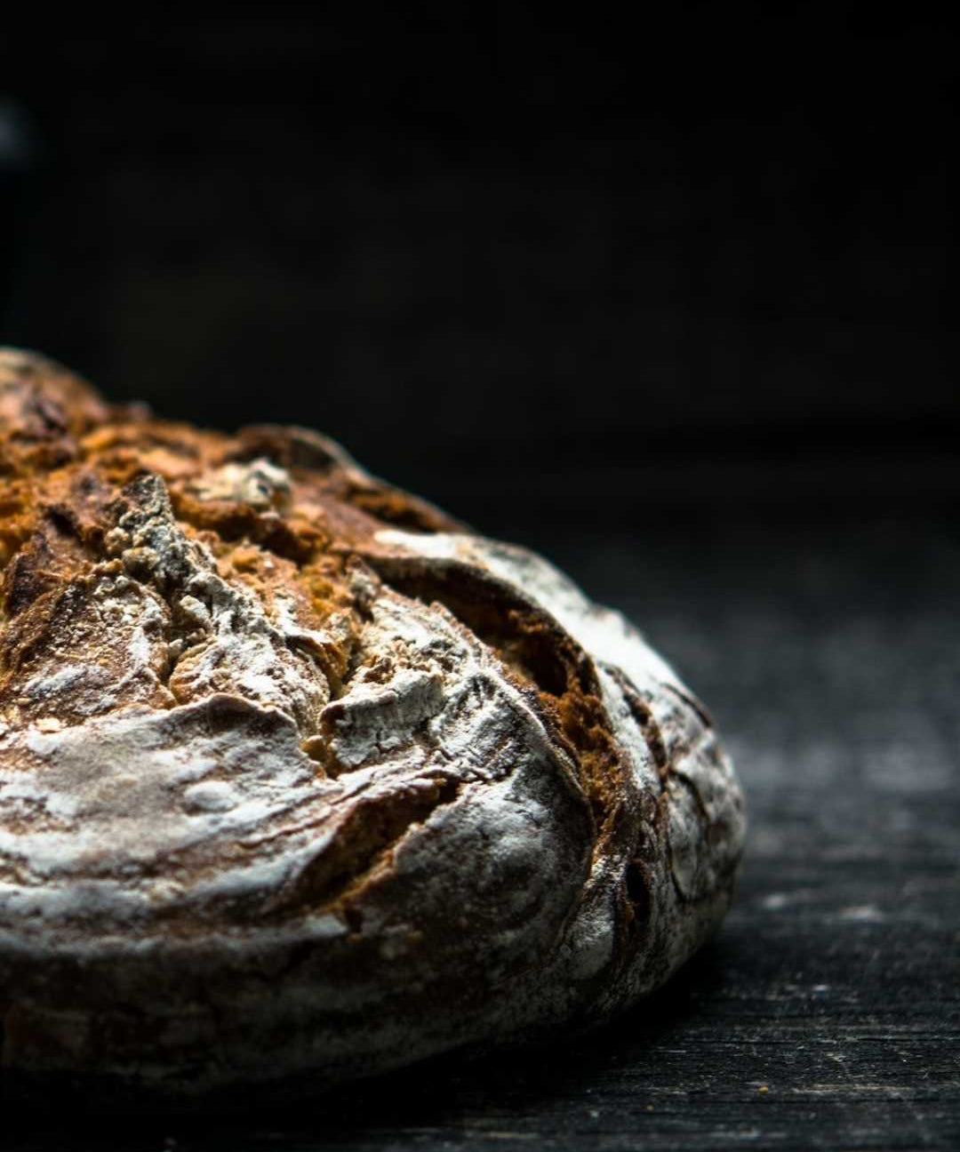 sourdough loaf close up on dark background